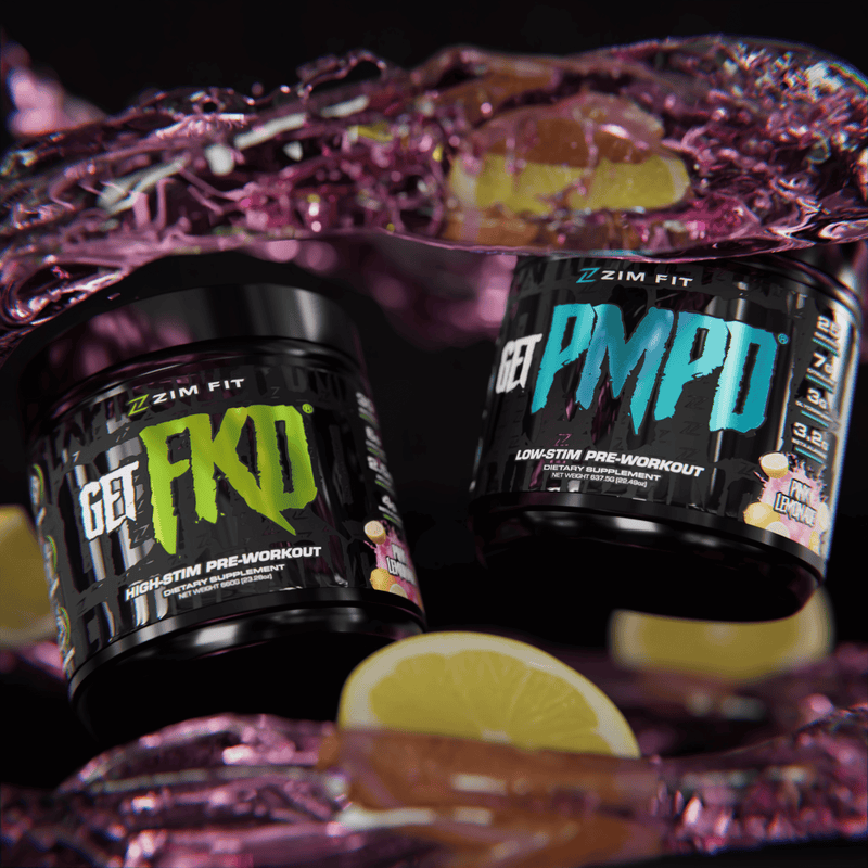 Two containers of Zim Fit pre-workout supplements on a reflective surface with lemons.