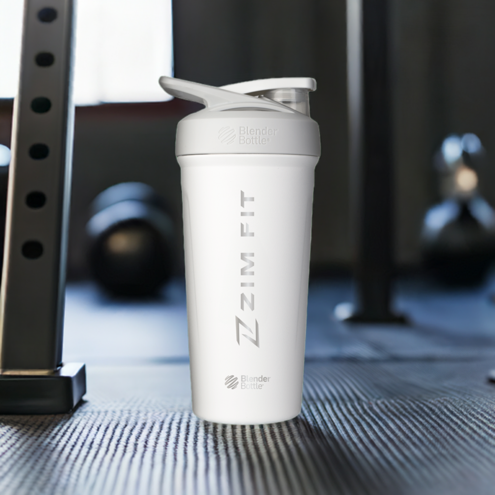 A black stainless steel shaker bottle with a screw-on lid and a handle, featuring the ZIM FIT logo.